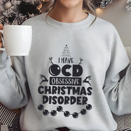 Gray sweatshirt with playful “I Have OCD – Obsessive Christmas Disorder” design featuring reindeer, Christmas tree, and ornaments.