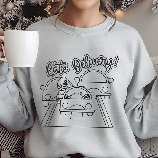 Grey sweatshirt with “Late Delivery” DTF design showing Santa in traffic surrounded by cars, humorous Christmas print.