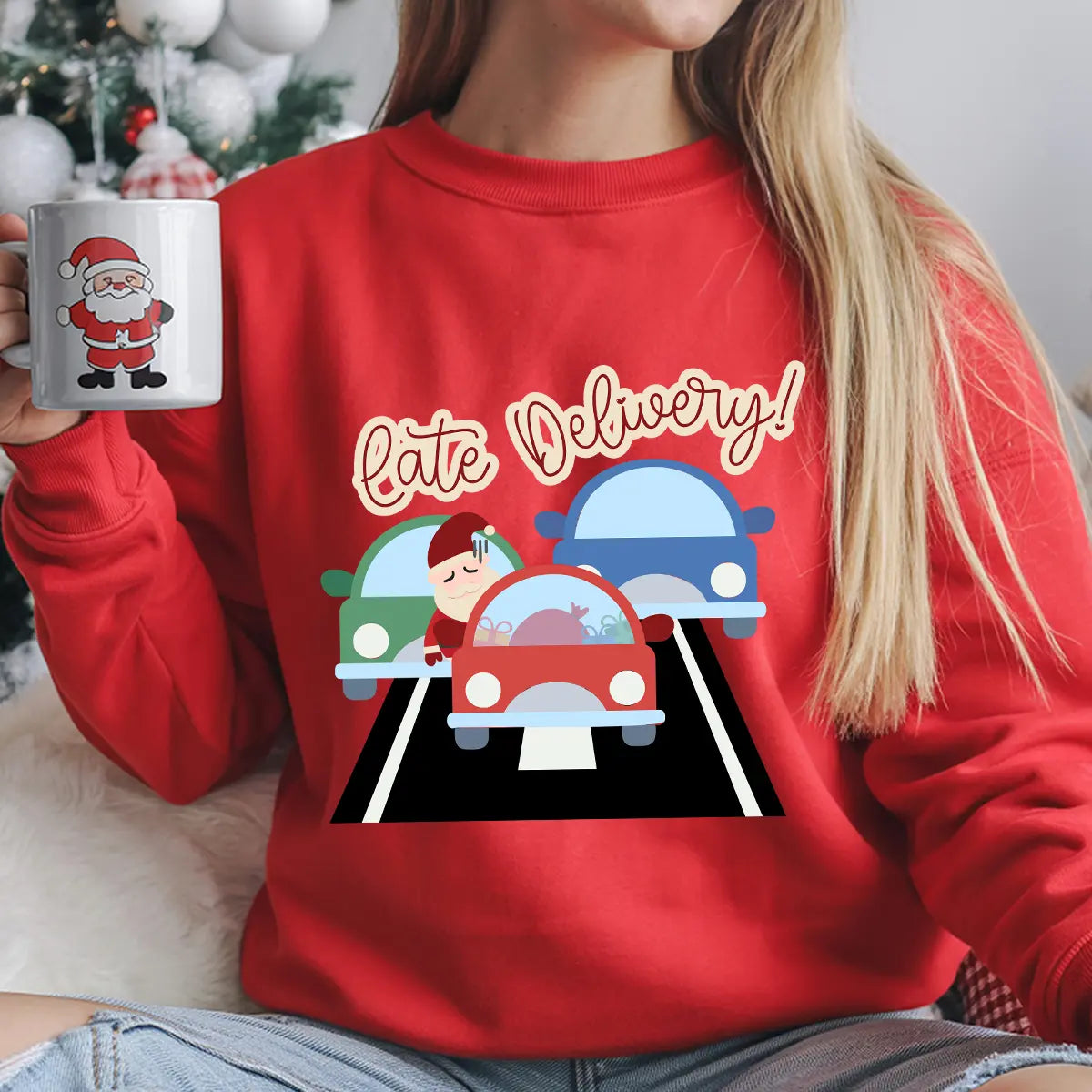 Red sweatshirt featuring a colorful “Late Delivery” DTF transfer design with Santa stuck in traffic, funny Christmas shirt design.