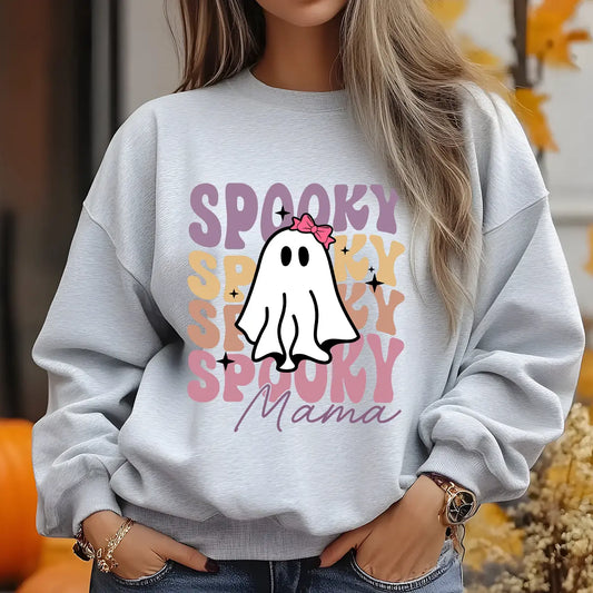 Light gray sweatshirt with a cute ghost wearing a pink bow and the words “Spooky Mama” in retro pastel colors, perfect for Halloween moms.