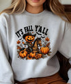 Gray sweatshirt with pumpkin-headed cowboy riding a horse surrounded by pumpkins and fall leaves—It’s Fall Y’all DTF transfer design.