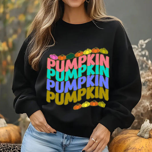 Black sweatshirt with colorful stacked “Pumpkin” text and pumpkin icons—fall-themed DTF transfer design.