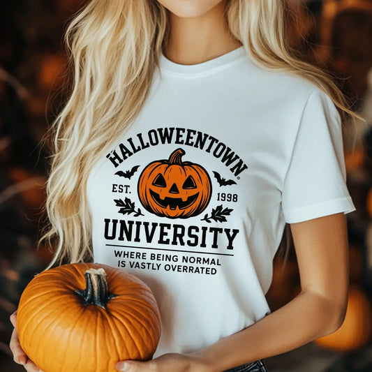 Join the spooky spirit squad with the Halloweentown University DTF Transfer! Featuring a classic jack-o’-lantern and gothic collegiate lettering, this design reads “Where Being Normal Is Vastly Overrated” — perfect for Halloween lovers who embrace the fun side of being different. Ideal for T-shirts, hoodies, or sweatshirts, it presses cleanly and lasts wash after wash. Great for Halloween parties, fall events, or cozy seasonal outfits!