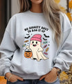 Gray sweatshirt with cute ghost wearing pink beanie holding pumpkin candy bucket, surrounded by bats and candies with text “No Diggity Bout To Bag It Up.”
