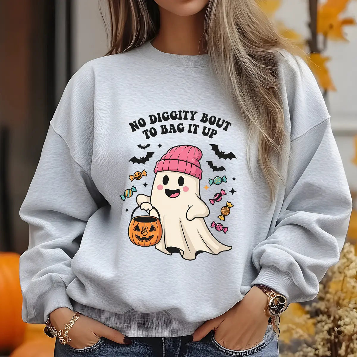 Gray sweatshirt with cute ghost wearing pink beanie holding pumpkin candy bucket, surrounded by bats and candies with text “No Diggity Bout To Bag It Up.”