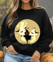 Black sweatshirt featuring a glowing full moon with bats and a creepy pumpkin scarecrow design in the center.