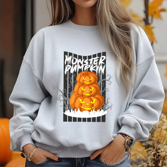 Gray sweatshirt featuring a stacked jack-o’-lantern Halloween DTF design with glowing pumpkins and spooky forest background.