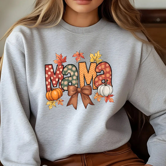 Gray sweatshirt with colorful “MAMA” fall design featuring pumpkins, leaves, and a bow, cozy autumn DTF transfer.