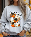 Grey sweatshirt with adorable Halloween design featuring cute ghosts, pumpkins, bows, and bats, ideal for cozy fall outfits.