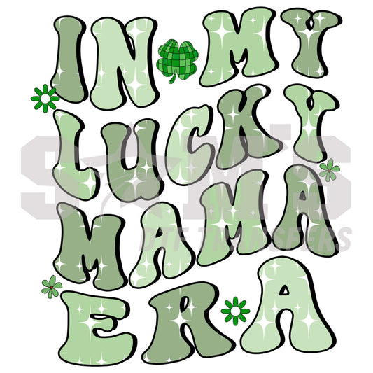 St. Patrick's Day themed graphic reading 'IN MY LUCKY MAMA ERA' with clovers and a whimsical font in shades of green.