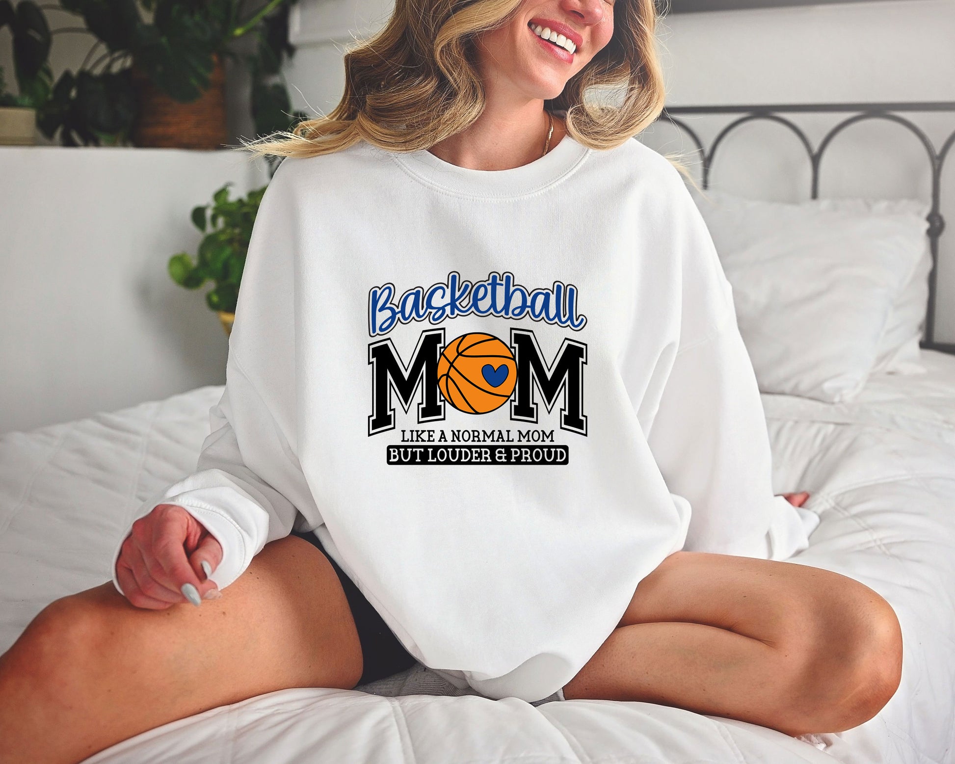 Basketball Mom Loud & Proud DTF Transfer on a white sweatshirt featuring bold text and a basketball heart graphic.