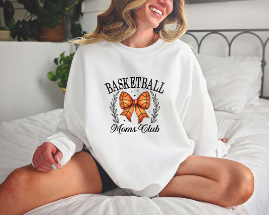 Basketball Moms Club DTF Transfer on a white sweatshirt featuring a basketball bow design with laurel accents.