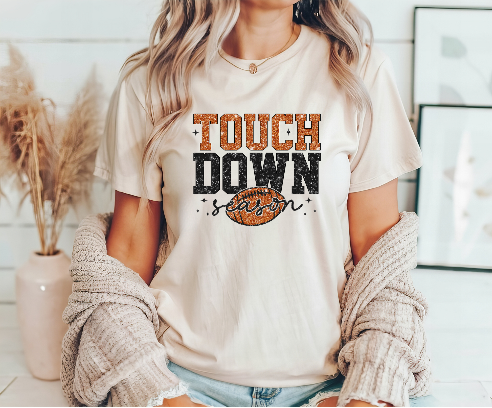 Touchdown Season Ready-to-Press DTF Transfer design on a t-shirt with bold orange and black glitter football lettering.