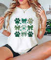 St. Patrick’s Day ready-to-press DTF transfer featuring green paw prints and bows with shamrock and plaid patterns