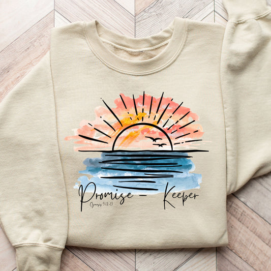 Promise Keeper Sunset DTF Transfer on a beige sweatshirt with watercolor design and scripture reference.