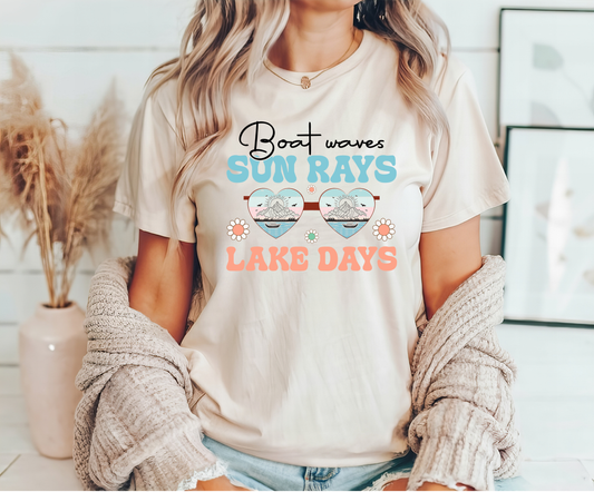 Boat Waves Sun Rays Lake Days ready-to-press DTF transfer design on a beige t-shirt.