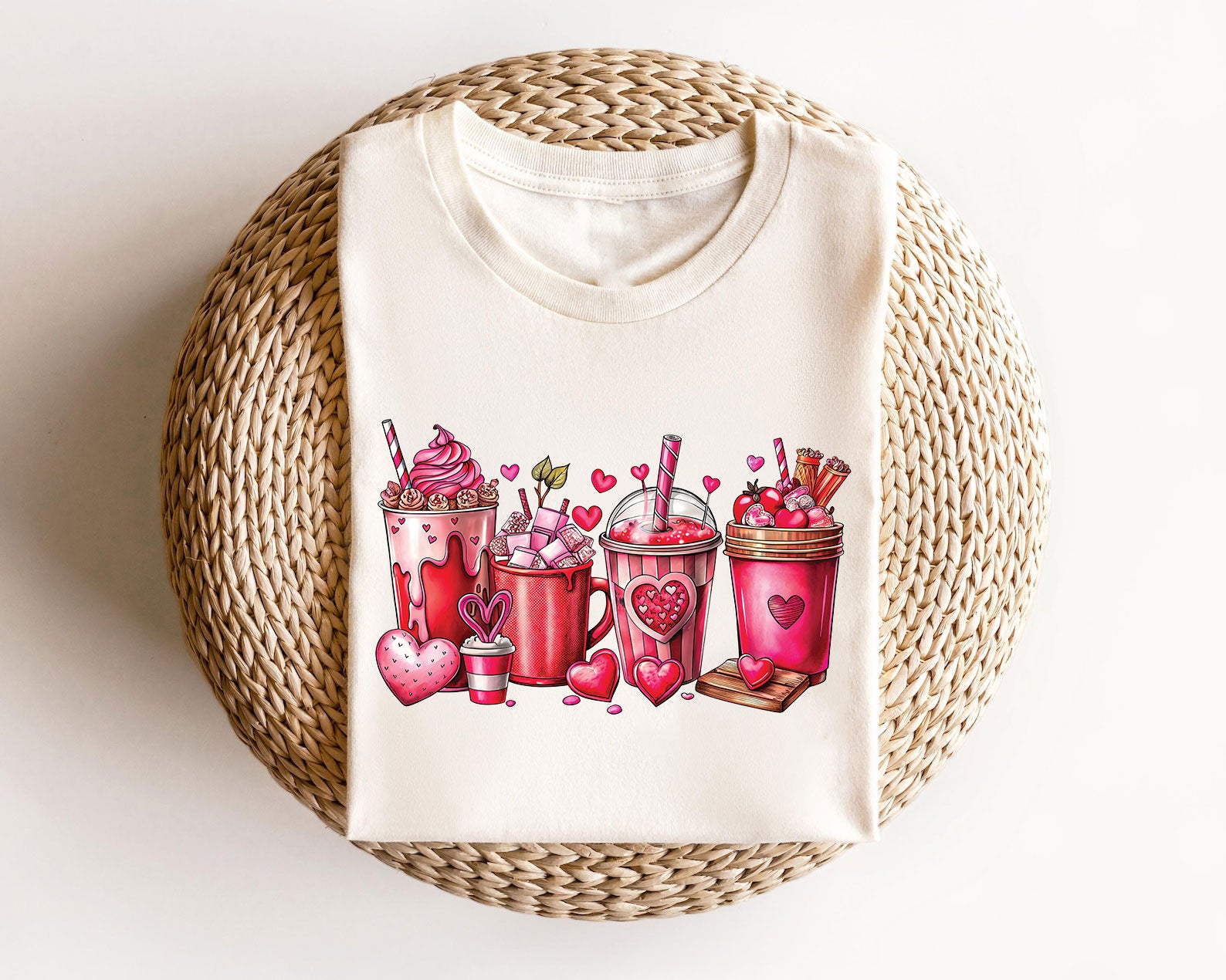 Valentine's Day Sweet Treats DTF Transfer design featuring heart-themed drinks and desserts on a cream-colored T-shirt.