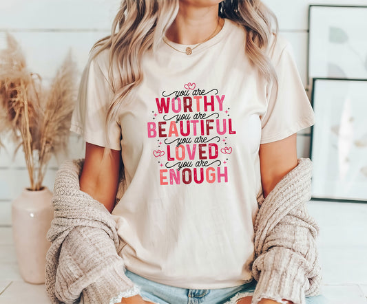 Worthy, Beautiful, Loved, Enough DTF transfer design with pink and red lettering on a cream T-shirt.