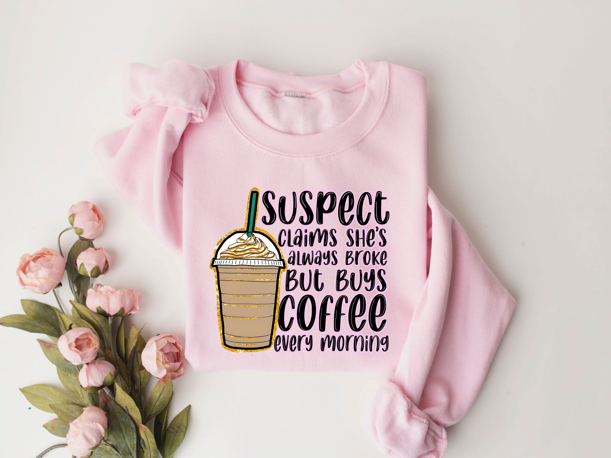 Coffee-themed DTF Transfer with iced coffee illustration and funny quote on a pink sweatshirt.

